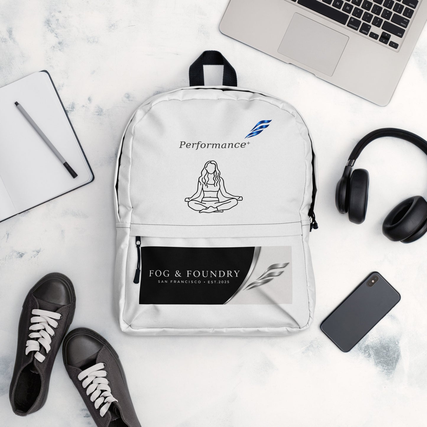 Fog & Foundry water-resistant backpack with 15-inch laptop sleeve, all-over print, padded straps, and white design.