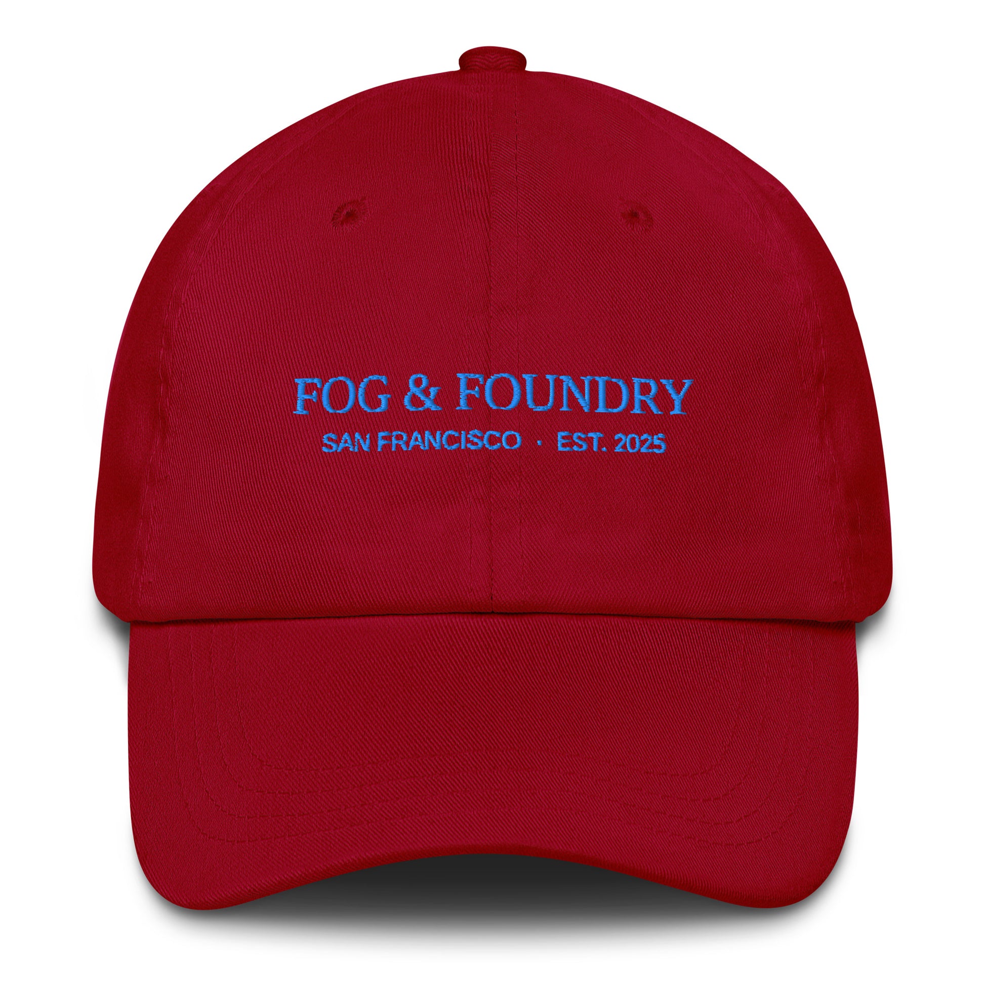 Red embroidered dad hat by Fog & Foundry with a classic six-panel design and curved brim, front view.