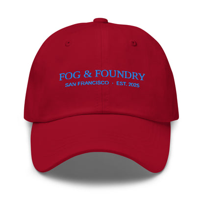 Embroidered cranberry dad hat by Fog & Foundry featuring a classic sportswear style and adjustable front panel.