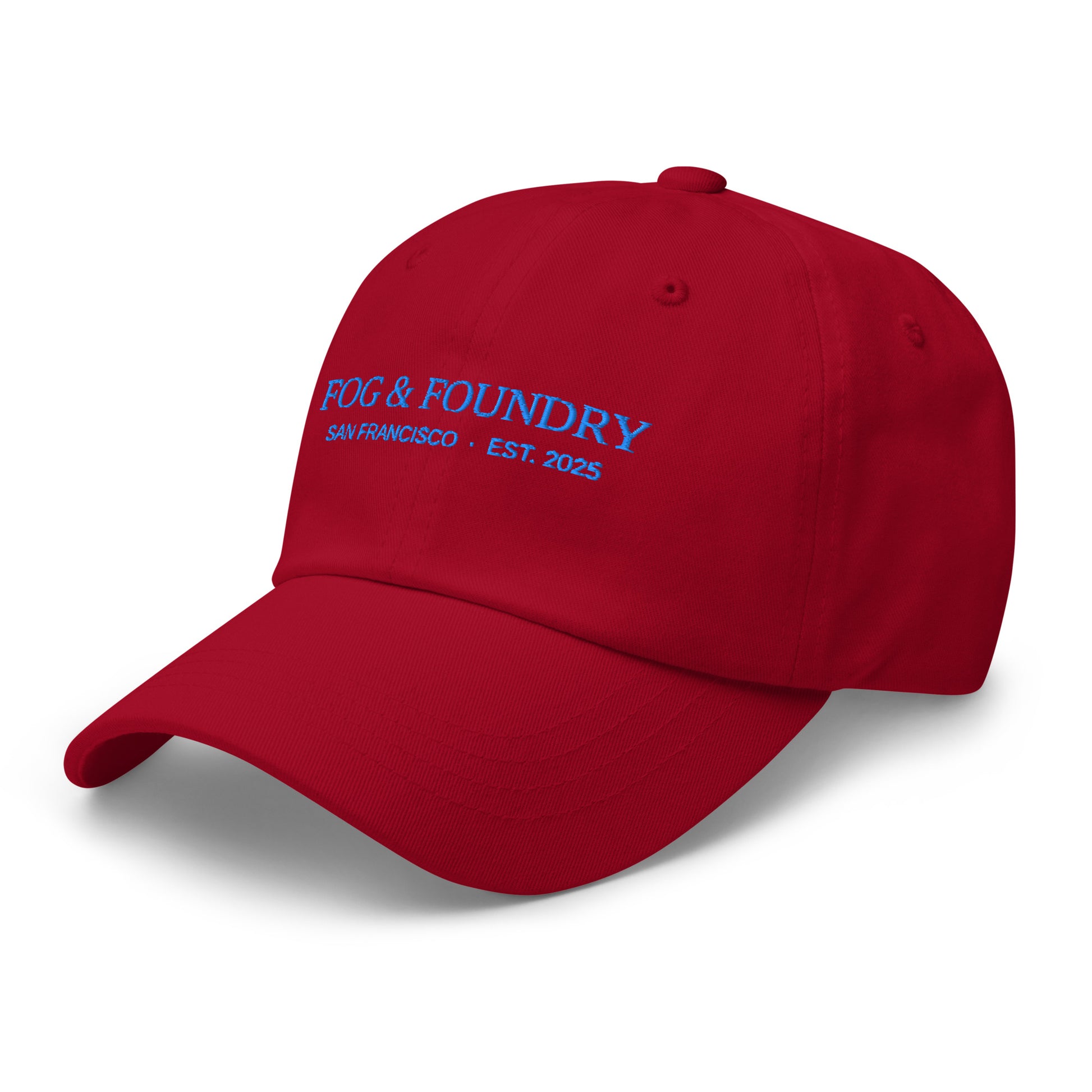 Embossed cranberry-colored dad hat by Fog & Foundry with embroidered logo on front, casual sportswear style.