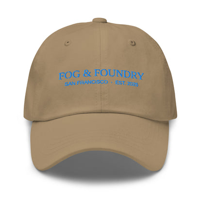 Khaki embroidered dad hat by Fog & Foundry with front logo, casual sportswear style, adjustable brim and classic design.