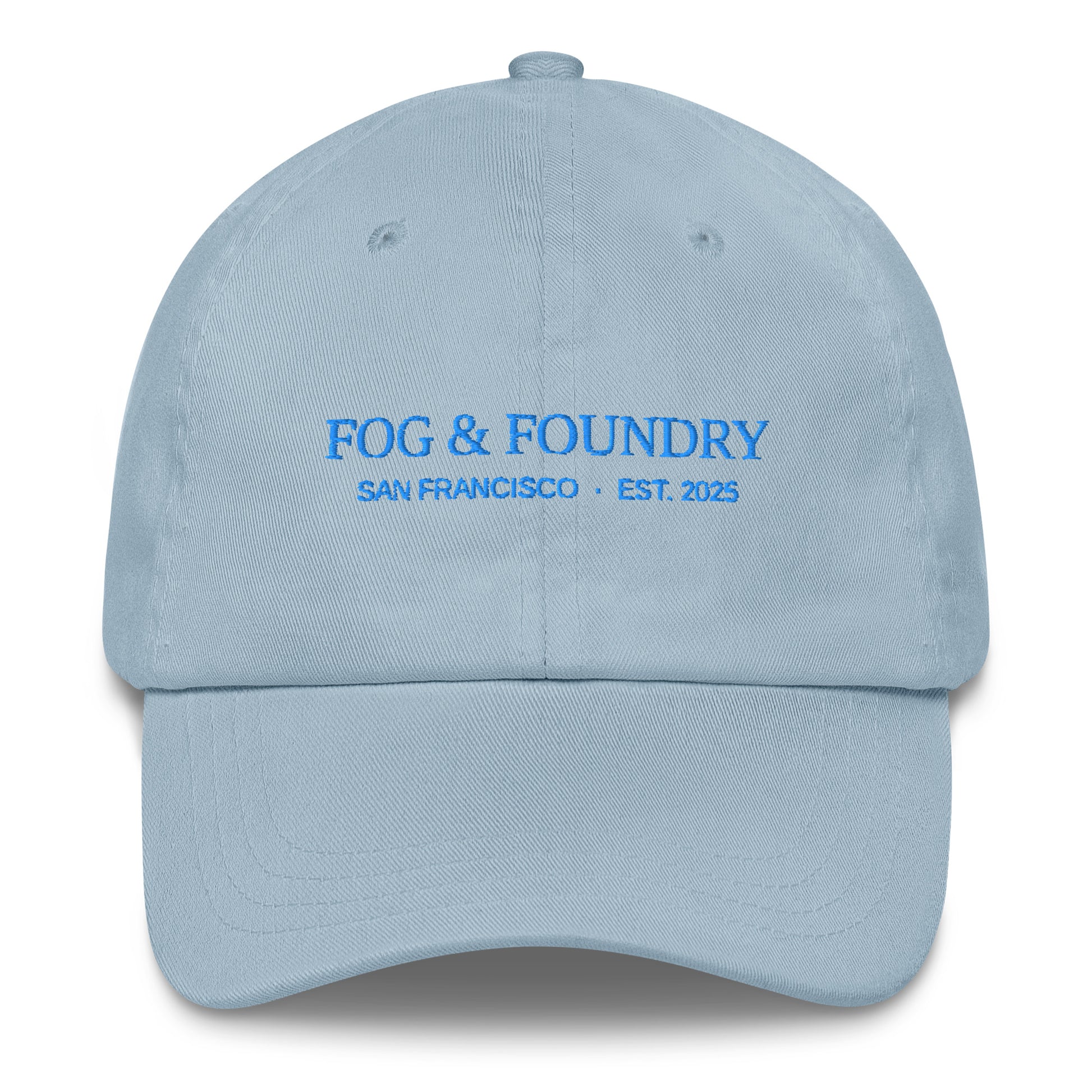 Light blue embroidered dad hat by Fog & Foundry featuring classic sportswear style and front stitching detail.
