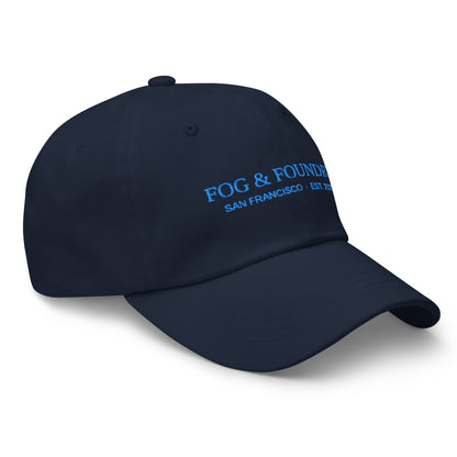 Navy embroidered dad hat by Fog & Foundry with curved brim and adjustable strap, shown from the right front view.