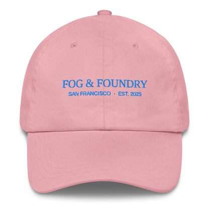 Pink embroidered dad hat by Fog & Foundry featuring a classic sportswear style with front embroidery and adjustable strap.