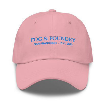 Pink embroidered dad hat from Fog & Foundry, classic sportswear style with front embroidery and adjustable strap.