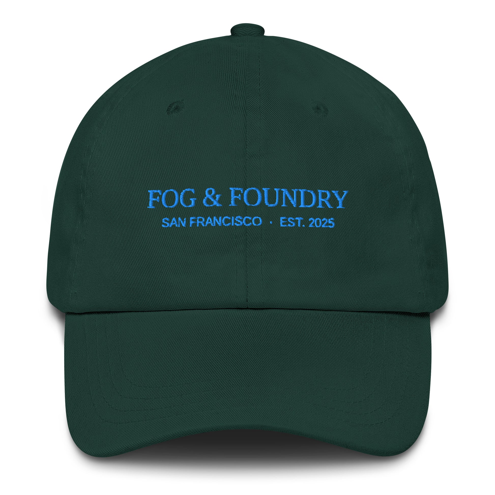 Embroidered classic dad hat from Fog & Foundry with a spruce color, featuring a front embroidered logo and adjustable strap.