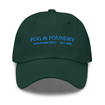 Embroidered classic dad hat in spruce green by Fog & Foundry featuring a curved brim and adjustable strap.