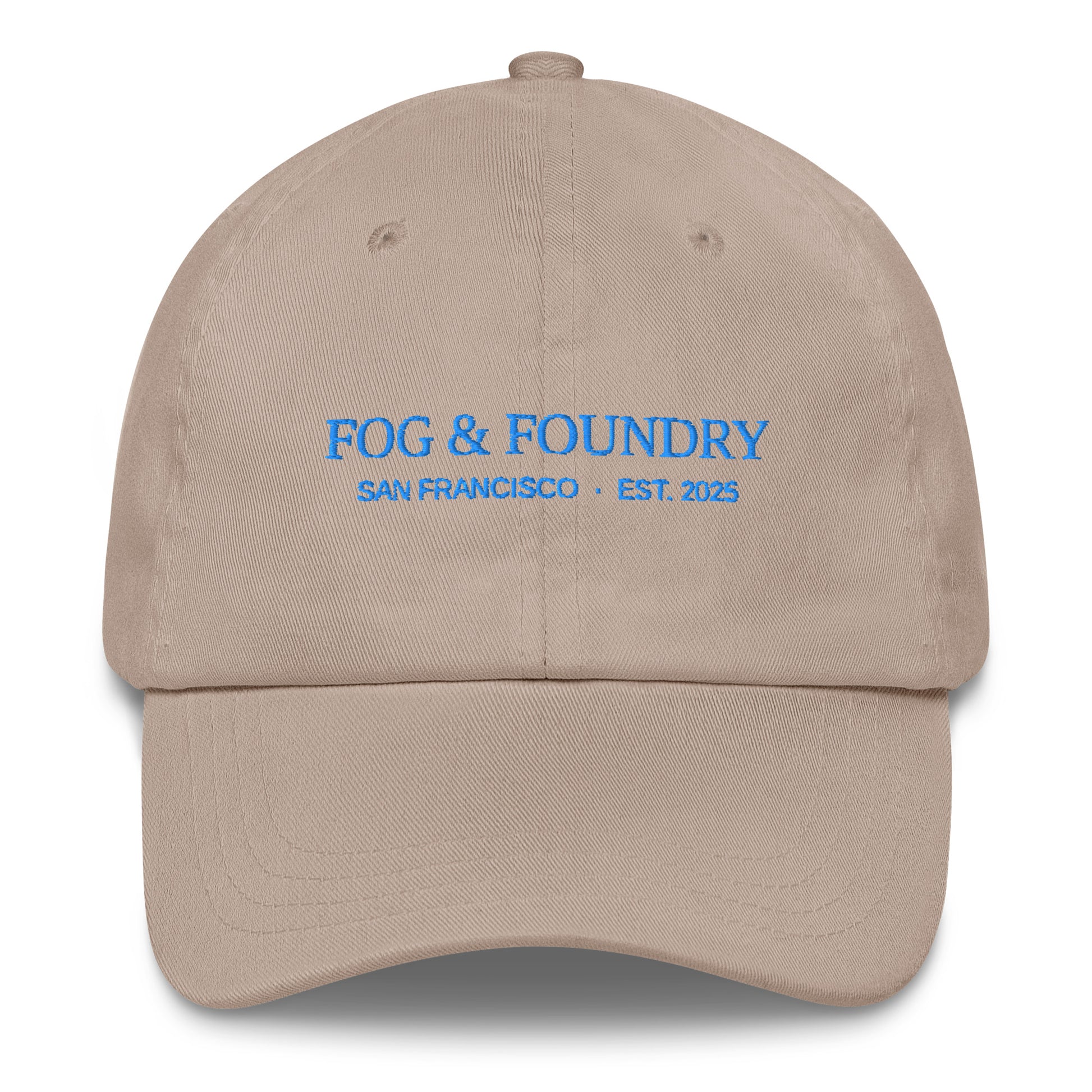 Embroidered classic dad hat from Fog & Foundry in stone color, featuring a front embroidery logo and adjustable strap.