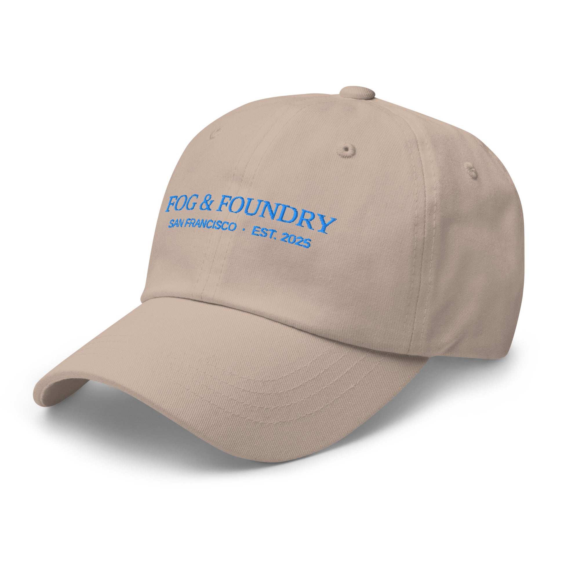 Stone-colored embroidered dad hat by Fog & Foundry, featuring a classic baseball cap style with front embroidery and adjustable fit.
