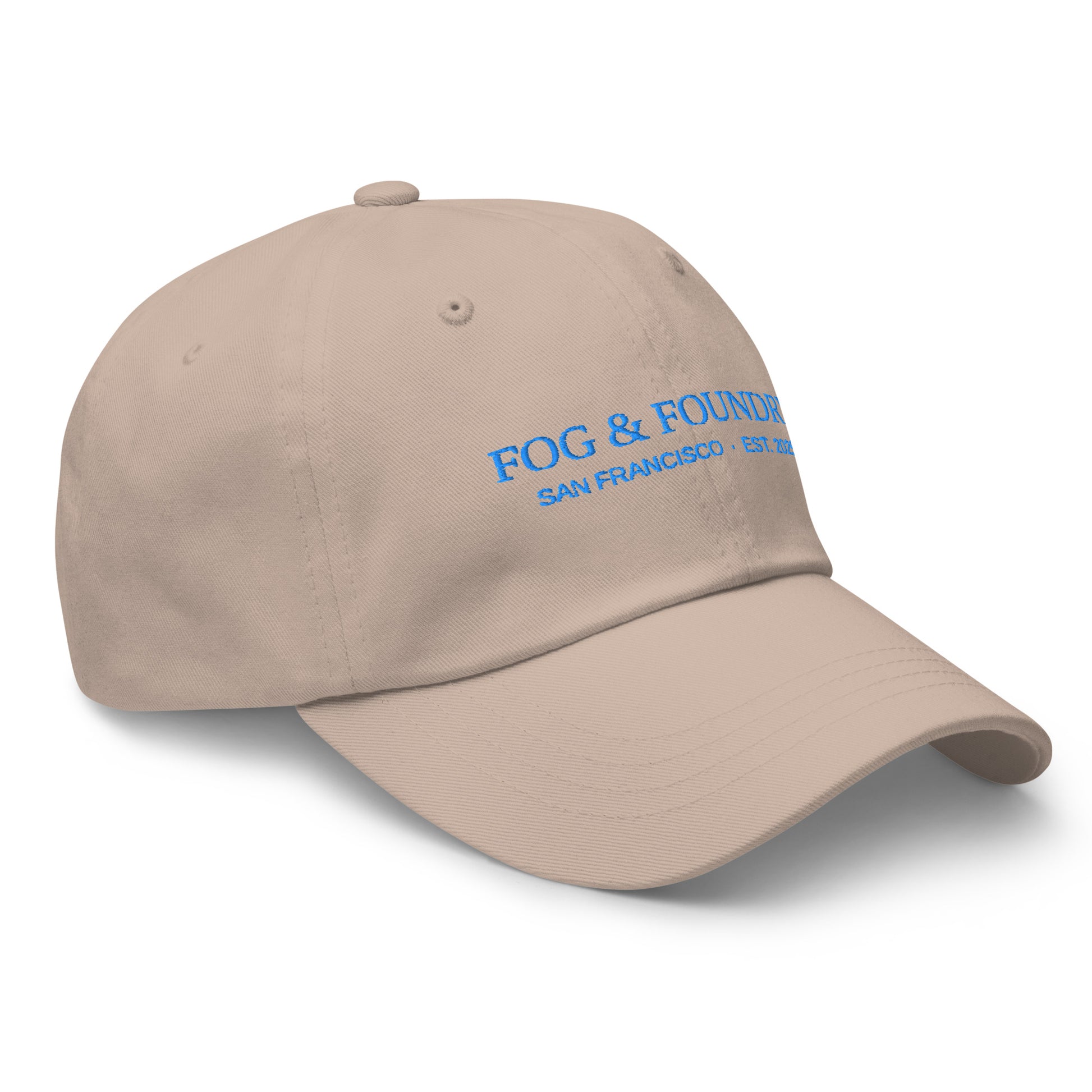 Fog & Foundry embroidered dad hat in stone color, showing the front right view with classic sportswear style.