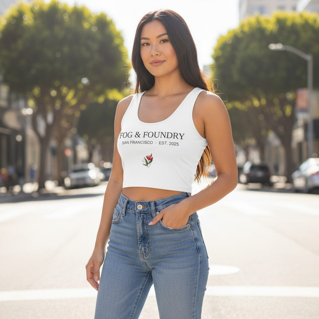 Woman wearing a white Fog & Foundry heavyweight cotton crop top with a floral graphic, styled with blue jeans.