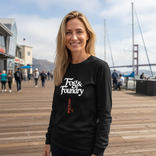 Woman wearing a black Fog & Foundry long-sleeve cotton shirt with a Golden Gate Bridge graphic on a San Francisco pier