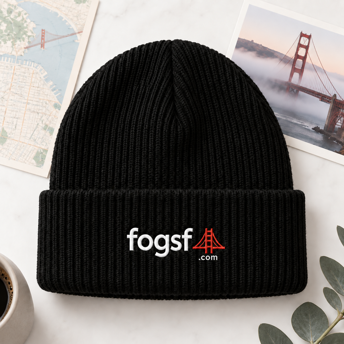 FogSF black beanie flatlay with .com beneath red bridge