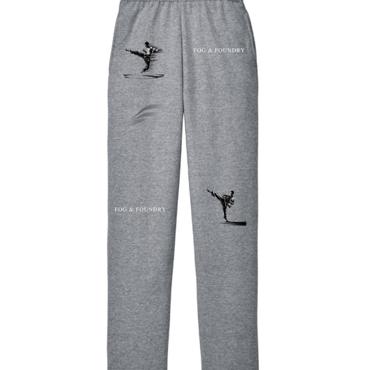 Gray Action Sweatpants by Fog & Foundry with a relaxed fit, shown on a model standing outdoors.