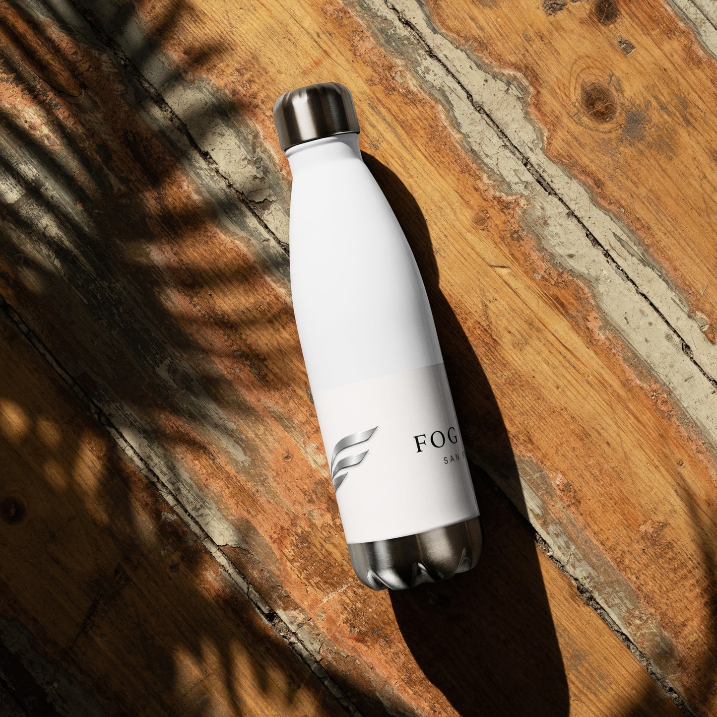 White 17oz stainless steel Twin Peaks water bottle from Fog & Foundry, shown from the back. Durable, sleek travel hydration.