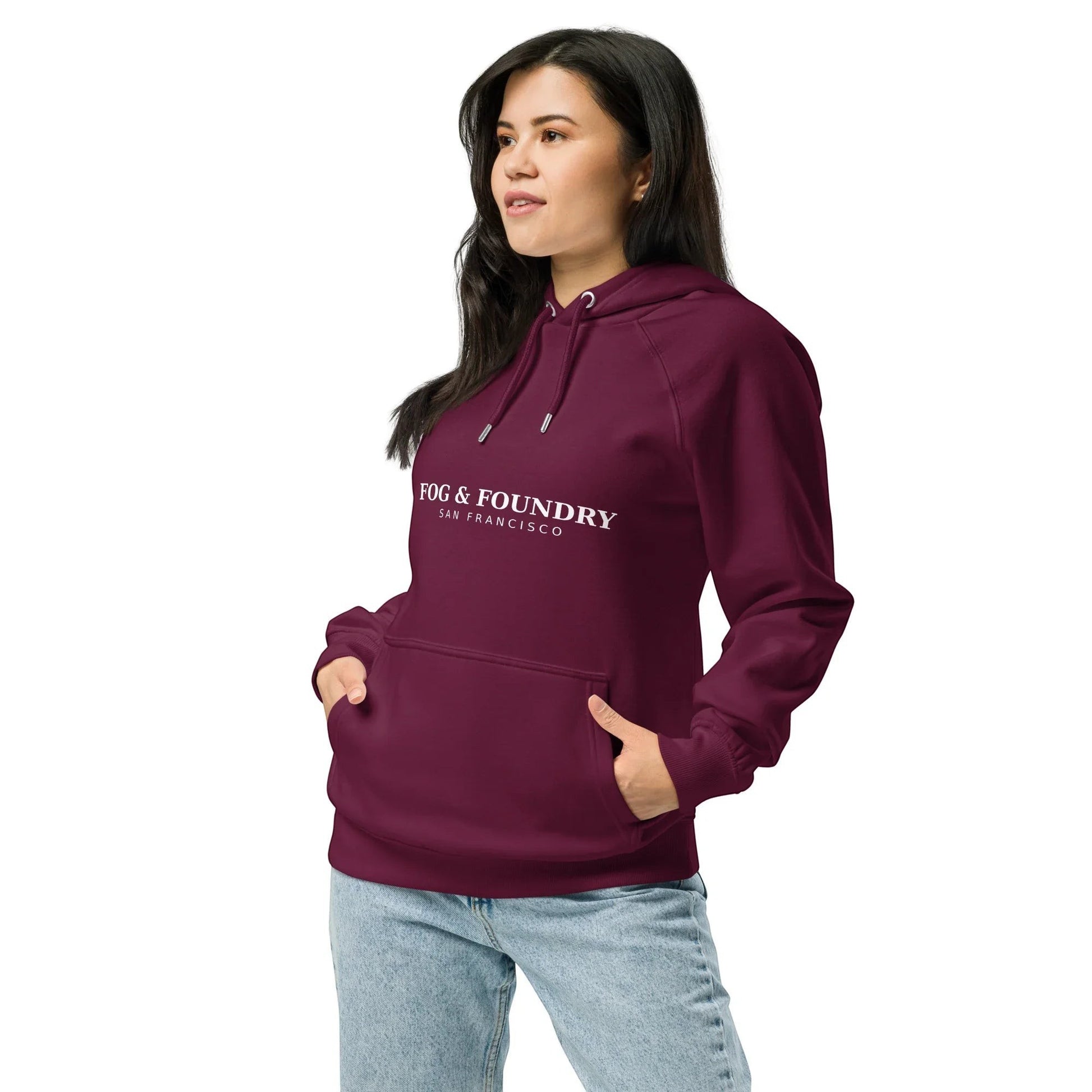 Unisex burgundy organic cotton raglan hoodie by Fog & Foundry, shown from the left front, casual and eco-friendly style.