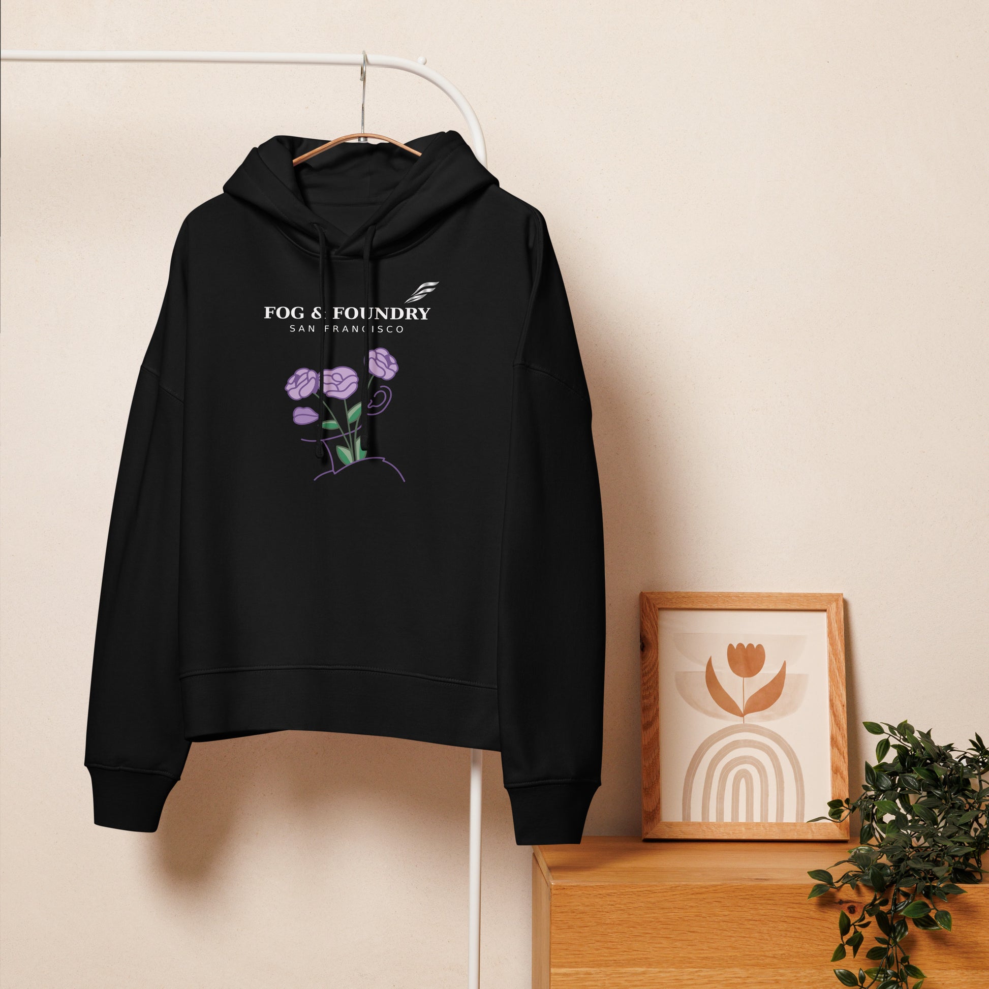 Black organic cotton mid-length hoodie for women by Fog & Foundry, shown from the front with a relaxed fit and casual style.