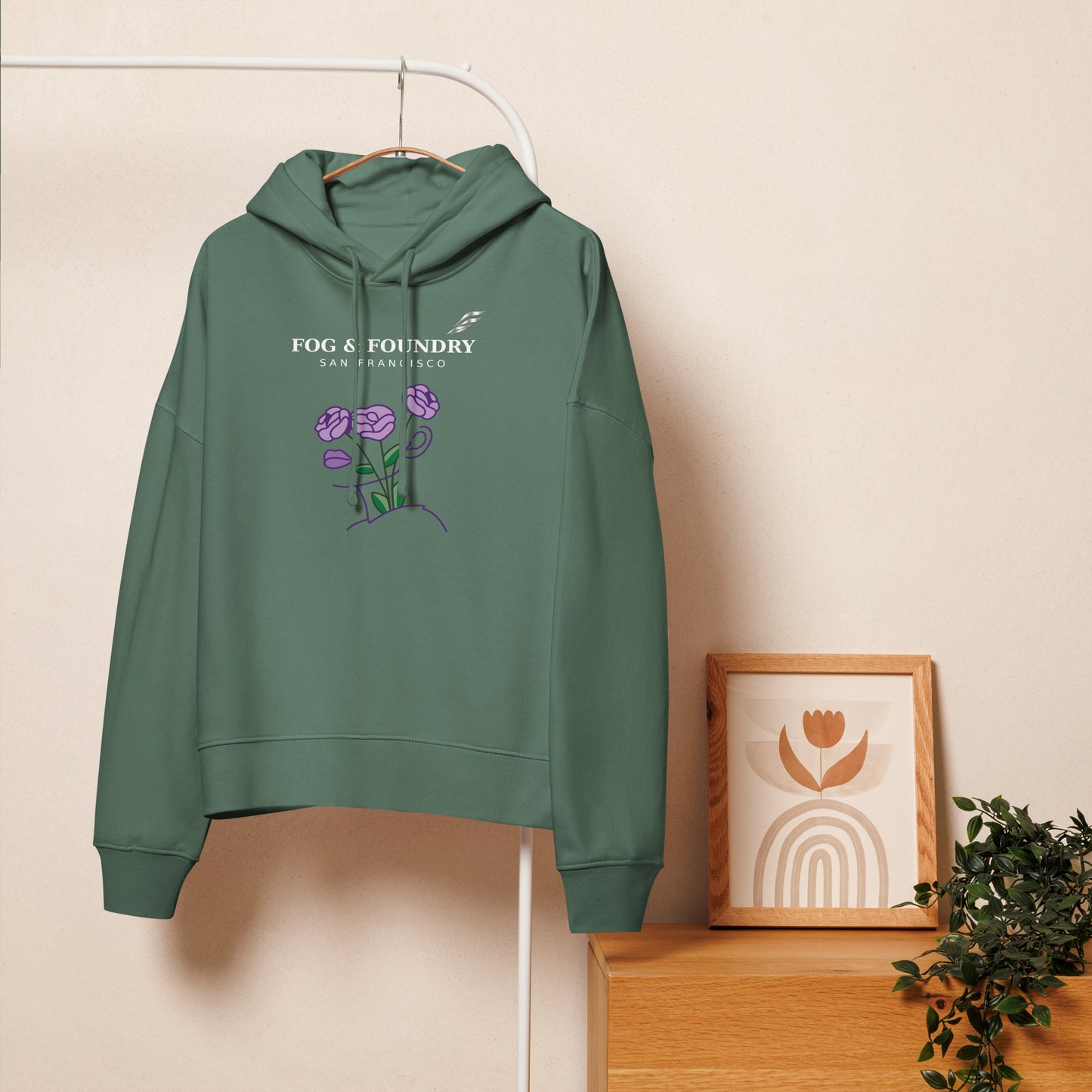 Green organic cotton mid-length hoodie for women by Fog & Foundry, casual front view showing comfortable fit and fabric texture.